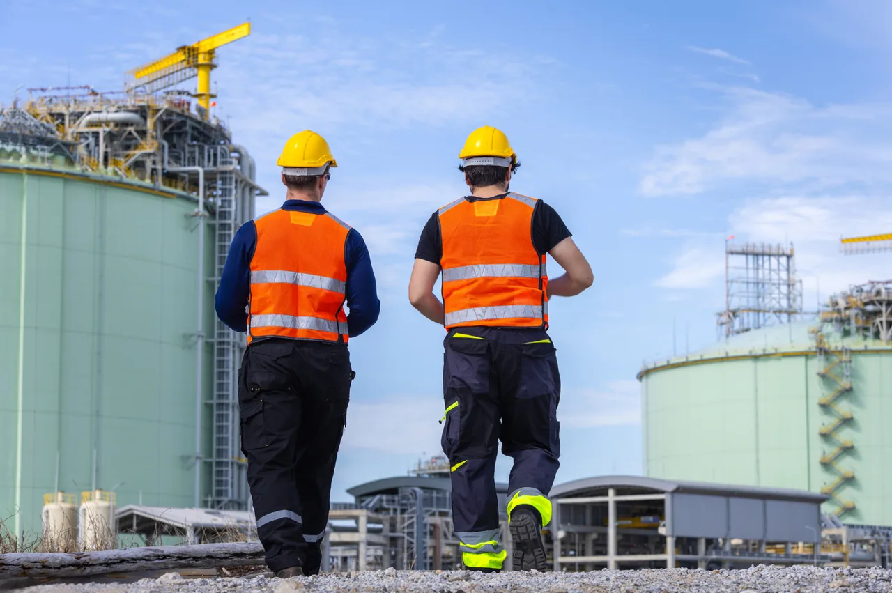 Industrial workers coordinating work at a plant site